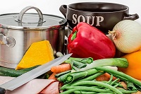 Stock pot with vegetables.